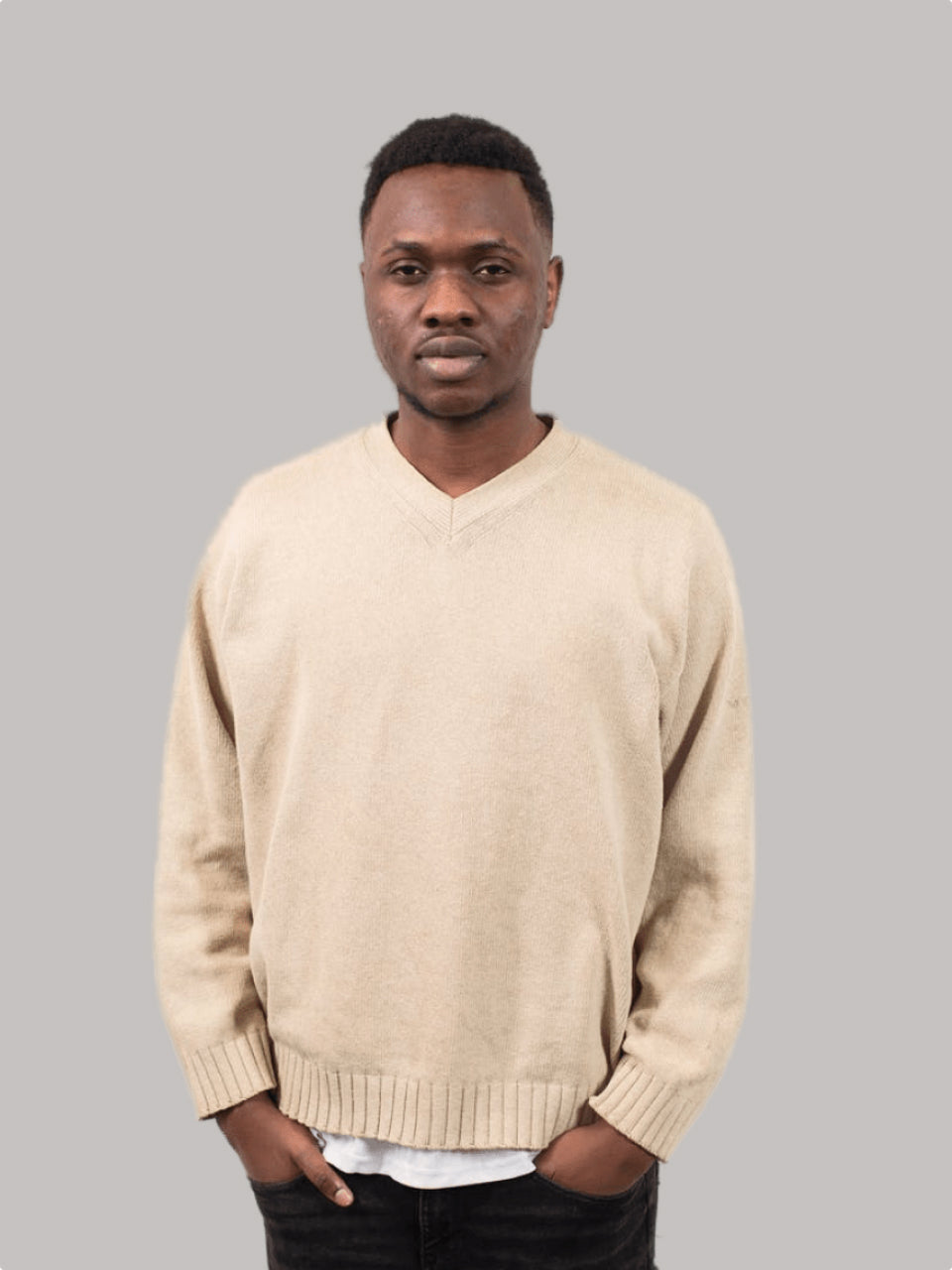 Beige V-neck knit sweater worn by a male model