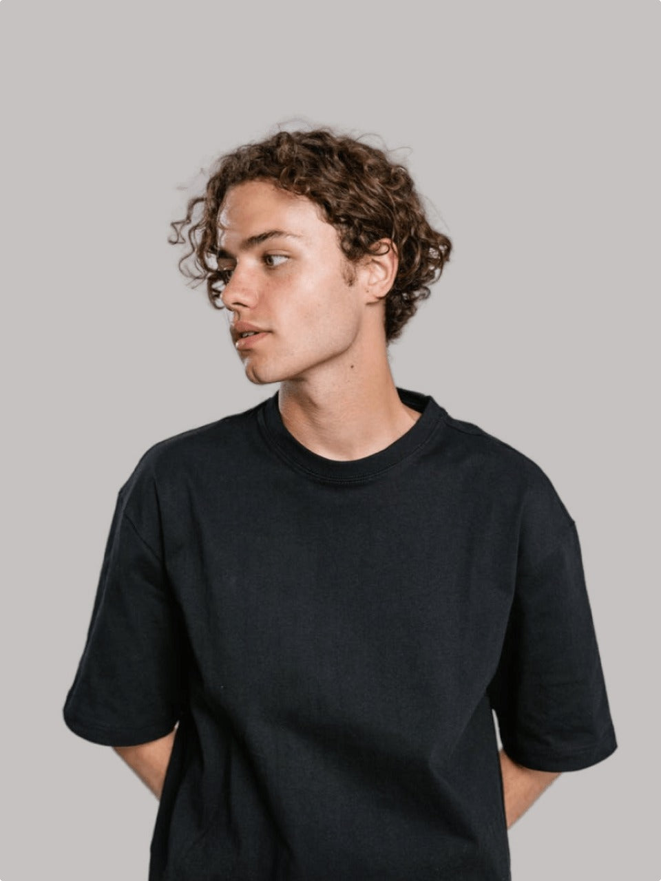 Black oversized boxy T-shirt worn by a male model