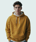 Mustard yellow pullover hoodie worn by a male model